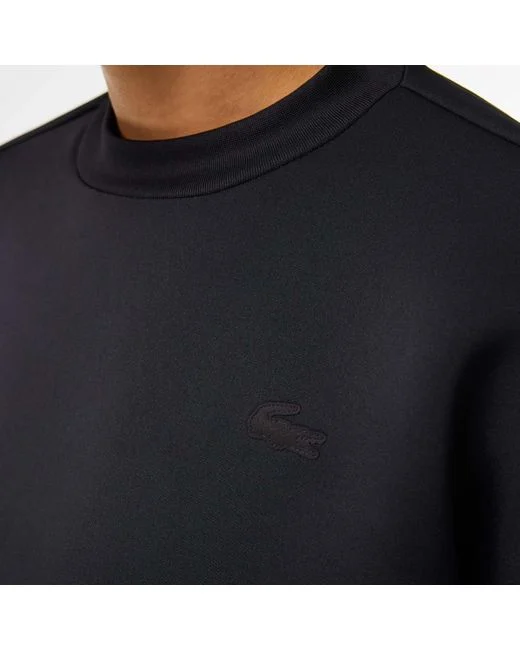 Felpa Lacoste nera con coulisse e vestibilità ampia